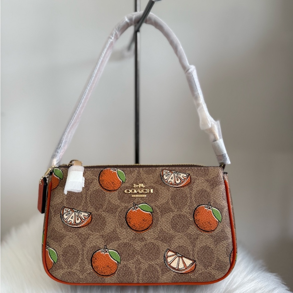 COACH Nolita 19 In Signature Canvas with Orange Print
